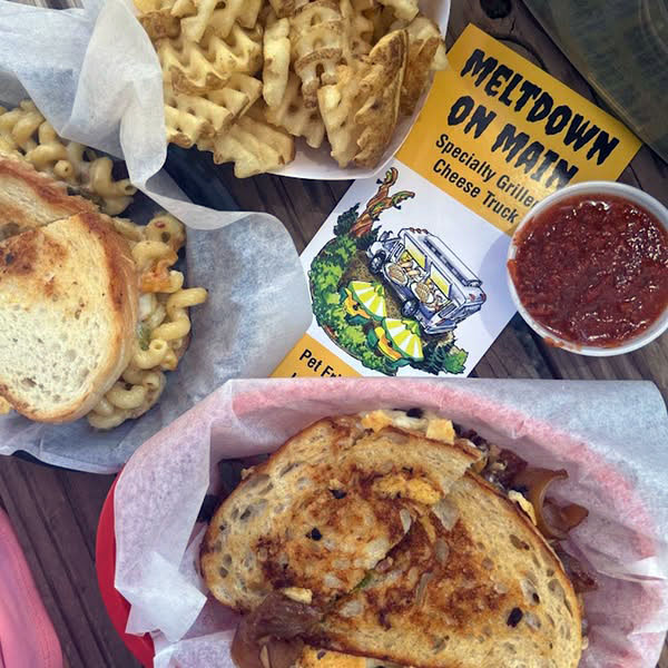 mac and cheese grilled cheese sandwiches with waffle fries at Meltdown on Main restaurant