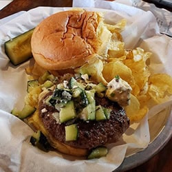 burger and chip basket at Riff Raff