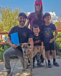 dog Rocky with his new family